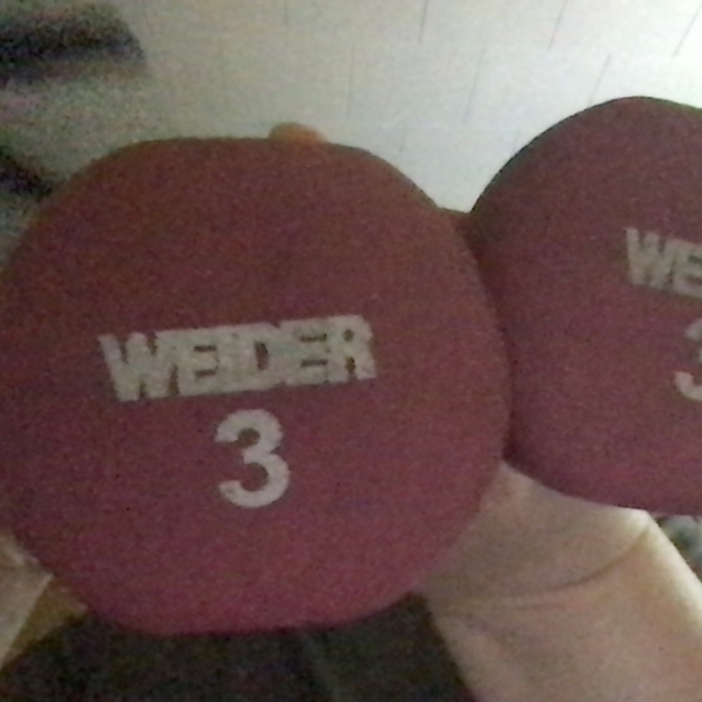 a set of pink 3 pound weights